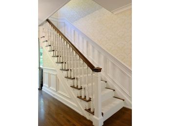 A Beautiful Wood Banister With Spindles And Curved Handrail At 2nd Flr
