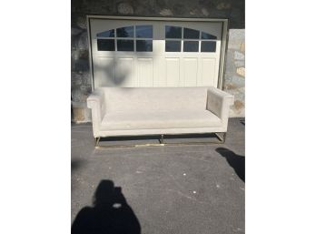 Oversized Beige Sofa On Gilded Metal Base