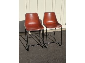 Pair Of CB2 Modern Leather Stools With Black Metal Base