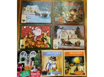 Lot Of 7 SEALED Holiday Puzzles Six Christmas One Halloween 1 Puzzle Has Tear In Cellophane On Back Side