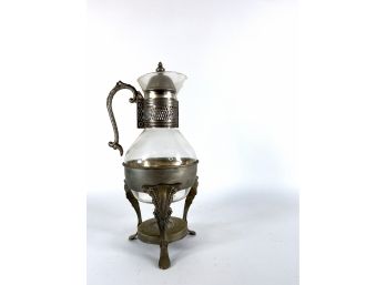 Ornate Carafe In Ornately Decorated Cabriole Legged Metal Stand