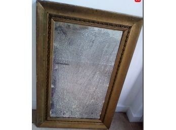 Antique Mirror  With Ornate Trim Has Visibility Through Many Silvering Lines