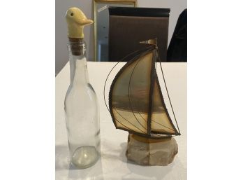 Fun Duck Topped Bottle And Vintage Metal Sailboat