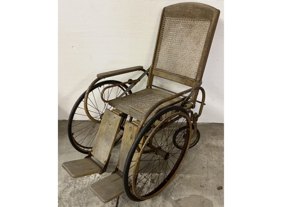 Circa 1900 Cane Seat Oak Wheelchair