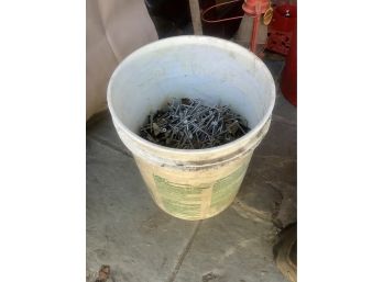Partial 5 Gallon Bucket Of Long Screws