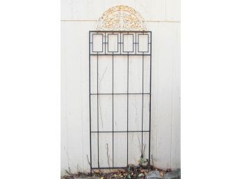 Wrought Iron Trellis With Ornate Arched Over The Door Or Wall Hanging
