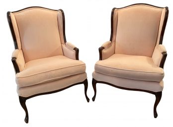Pair Of Vintage Wing Back Chairs In A Pinkish Velvet Upholstery.