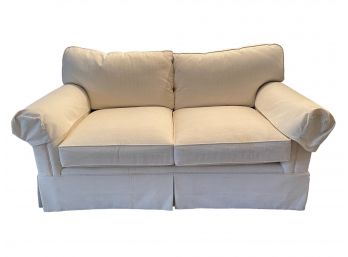 Rolled Arm Love Seat In A Light Color Upholstery . #1