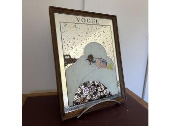 A Vogue Framed Mirror With Chrome Stand