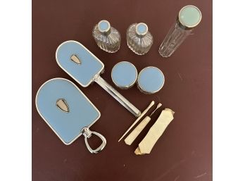 An Art Deco Metal Alloy And Blue Enamel Vanity Set With Mother Of Pearl Nail Kit