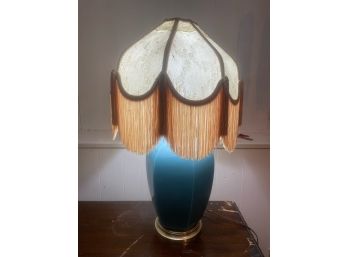 Blue Table Lamp With Fringe And Lace Detail On Shade