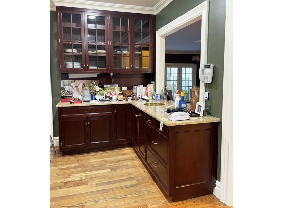 A Corner Run Of Mahogany Kitchen Cabinets (Uppers And Lowers), Granite Counters And Brass Prep Sink