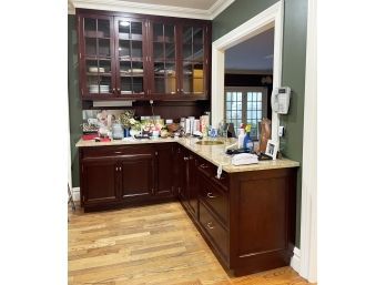 A Corner Run Of Mahogany Kitchen Cabinets (Uppers And Lowers), Granite Counters And Brass Prep Sink