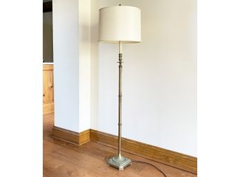 An Elegant Brass Standing Lamp