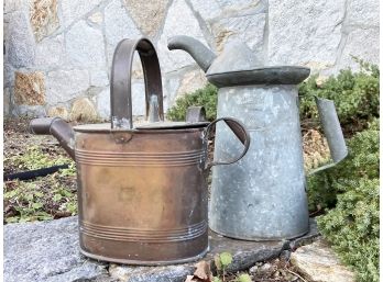A Pair Of Watering Cans