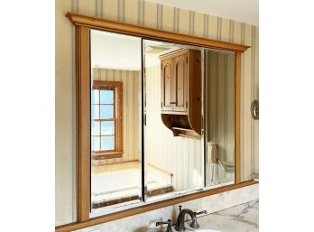 A Large Mirrored Built In Medicine Cabinet With Pine Trim