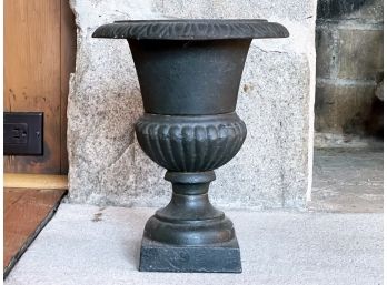 An Antique Cast Iron Urn