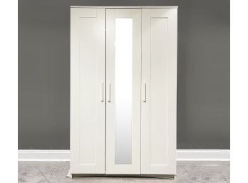 A Modern Wardrobe Cabinet With Mirrored Panel Door
