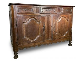 A Mid 19th Century Carved Oak Sideboard
