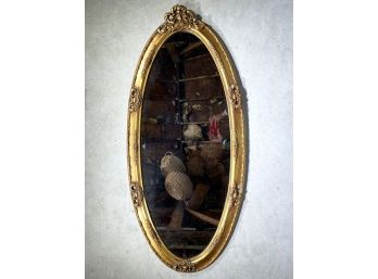 A Vintage Oval Gilt Framed Mirror