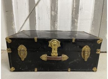 A Black Trunk Filled With Fabric