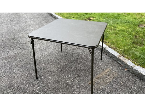 A Black Vinyl Foldable Card Table By Meco Made In USA
