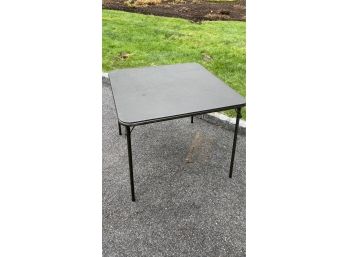 A Black Vinyl Foldable Card Table By Meco Made In USA  - 1 0f 2