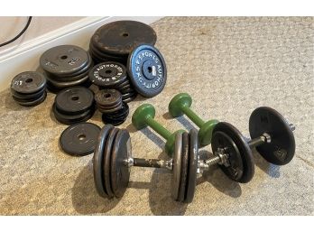A Group Of Dumbbell Weights And More