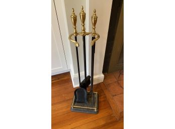 A Four Pieces Brass And Metal Fireplace Tools