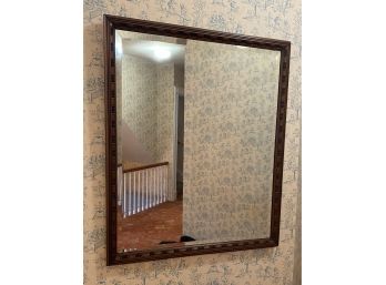 An Antique Beveled Solid Wood Mirror