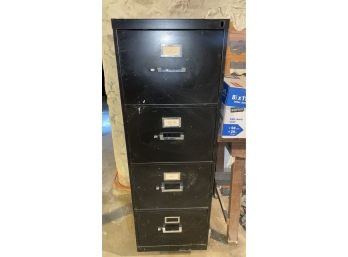 A Three Drawers Black Metal File Cabinet.