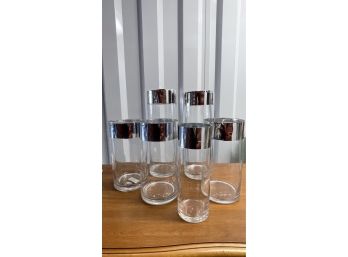 A Group Of Clear Glass Vases With Silver Tape Added To Edge - Tallest Vase 5'diameter X 14'h