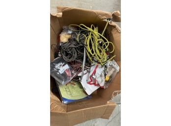 A Mixed Box Full Of Garage Items - Bungee Cords, Bicycle Seats & More