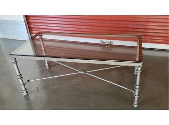 A Glass Top Rectangle Cocktail Table With Matte Silver Distressed Frame - 40'long X 20'd X 16'h