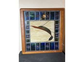 AN ARTS AND CRAFTS STAINED GLASS WINDOW