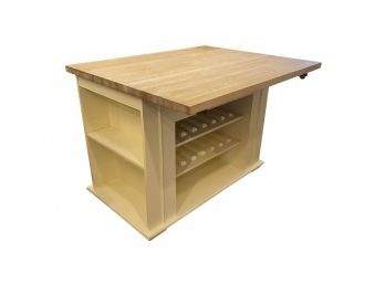 A White Kitchen Island With Butcher Block Top & Drop Leaf