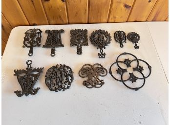 Group Of 10 Cast Iron Trivets