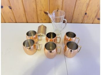 Group Of Copper Mugs, Glass Pitcher And Stirrer, And German Flask