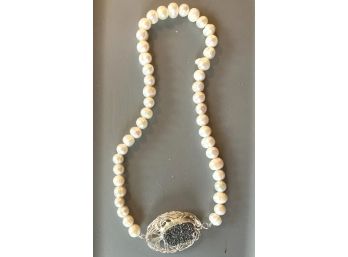 Necklace Of Faux Pearls With A CrushedGemstone Set In A Wirework Pendant