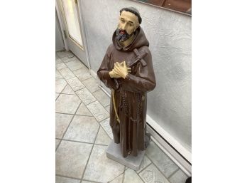 Large Religious Statue In Brown Cloak