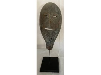 Carved Mask On A Stand