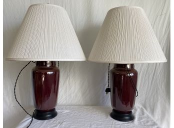 Pair Of Burgundy Colored Lamps