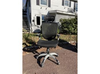 An Adjustable Mesh Office Chair With Lumbar And Neck Support