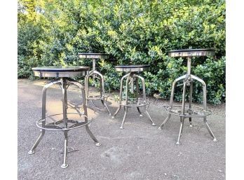 A Set Of 4 Adjustable Height Metal Stools With Wood Seats