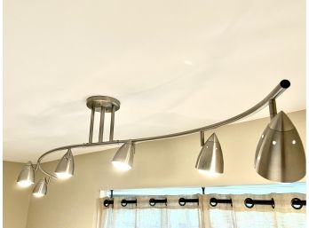 A Brushed Chrome Finish Curved Multi Head Light Fixture