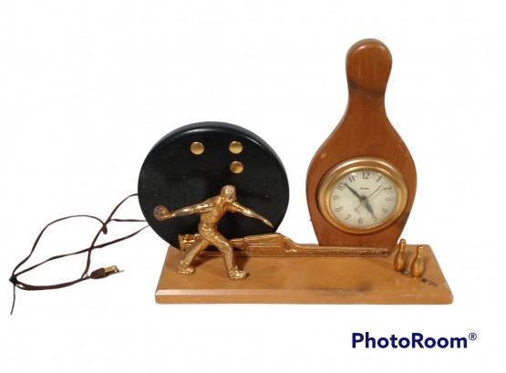 ANTIQUE BOWLING THEMED CLOCK MADE BY UNITED CLOCK COMPANY  TESTED AND WORKS