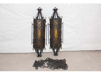 Pair Of Spanish Revival Style Iron Pendant Lights With Amber Glass And Chains