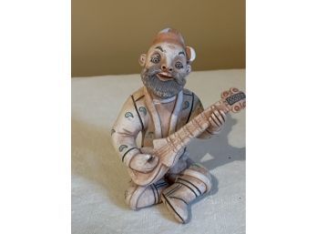 (#18) Clay Pottery Figurine Man Sitting Playing Instrument 4'H