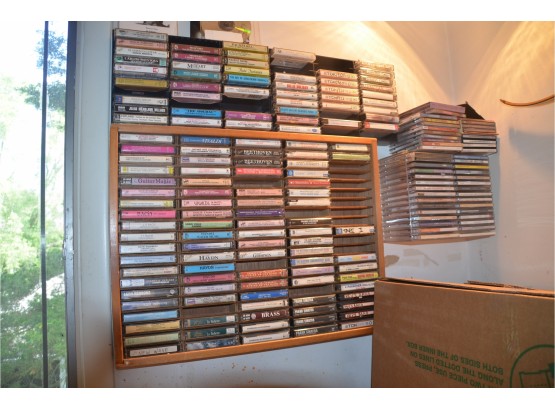(#82) Lot Of Assorted CD's And Cassette Tapes With Display Case