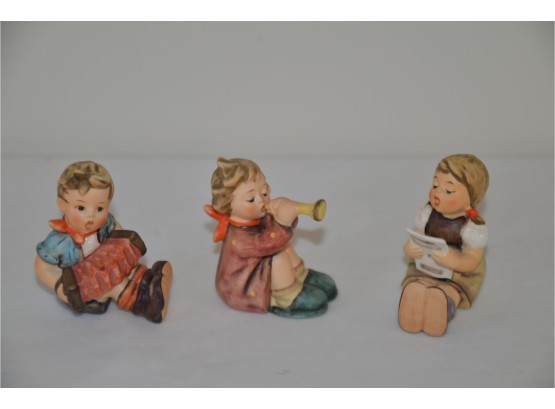 (#145) Hummel Goebel Figurines: GIRL WITH SHEET MUSIC #389, BOY WITH ACCORDION #390, GIRL WITH TRUMPET #391